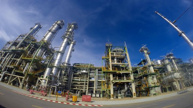 Oil Refinery plant with cloudy sky , Time lapse