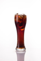 Glass of cola on white background