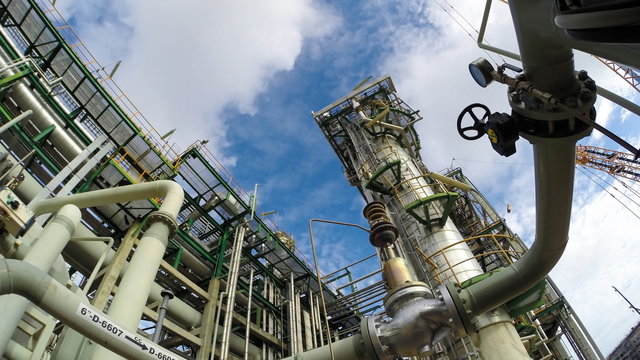 Oil Refinery plant with cloudy sky , Time lapse