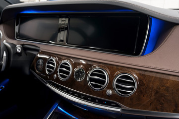 Modern car dashboard. Air conditioning system. Interior detail.