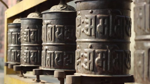 Prayer wheel close up. The approach of using the slider