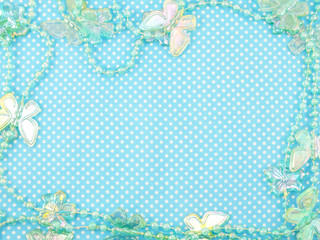 blue polka dot background and butterflied decoration with space copy