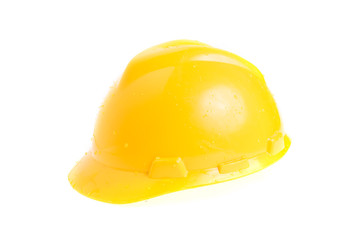 Plastic safety helmet and water drops isolated on white background