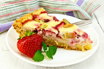 Pie strawberry-rhubarb with sour cream and berries on board