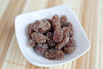 Rakkasei Amanatto is a Japanese confection dusted with sugar and boiled soft peanut.
