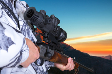 Obraz na płótnie Canvas hunter with his rifle