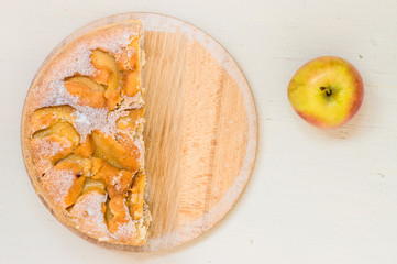 Half of apple pie and one apple