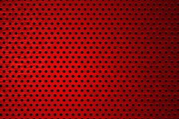 Metal background. Red perforated brushed metal. 