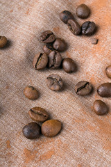 Fototapeta na wymiar Coffee beans on fabric background