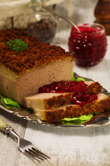 Homemade meat pie with vegetables, served with cranberry sauce