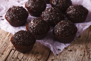 Delicious chocolate truffles close-up on the table. Horizontal
