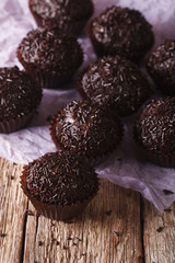 Delicious chocolate truffles close-up on the table. Vertical
