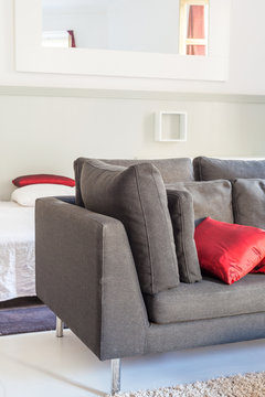 Modern apartments cozy furniture: a sofa with pillows