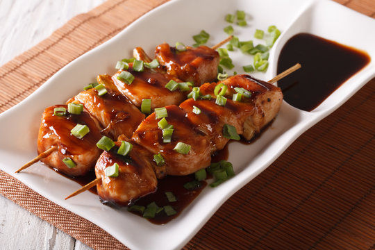 Japanese food: chicken yakitori on skewers close-up. Horizontal

