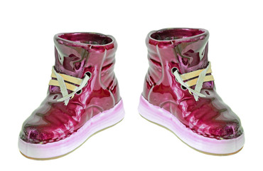 Red ceramic boots, sneakers, close up, isolated, white background.