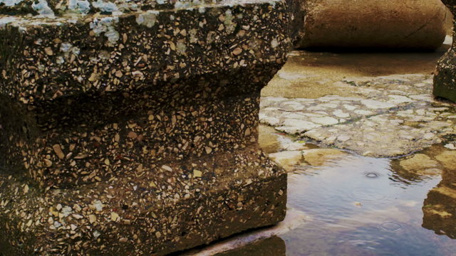 Royalty Free Stock Video Footage of ancient column bases in a puddle shot in Israel at 4k with Red.