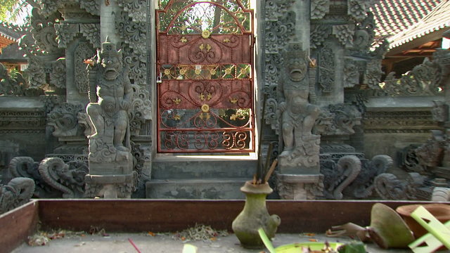 Stone statue and a wall in Bali.
