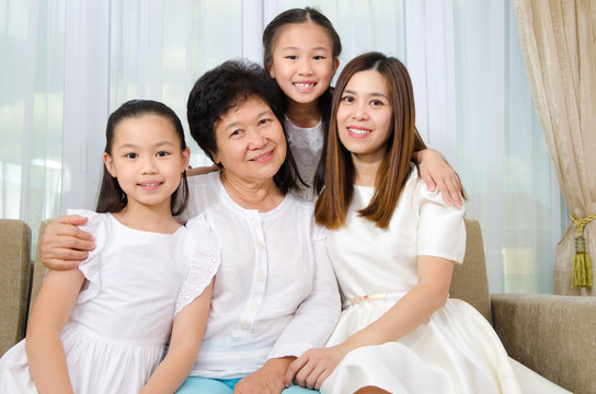 Asian senior woman together with daughter and granddaughters