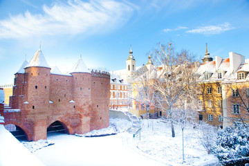 Warsaw Barbacan fortress (castle) in winter is in the capital city of Poland. Old town is the historic center of Warsaw