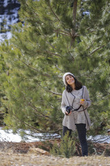 Photographer Woman in the Pine Forest
