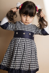 Small lovely girl isolated on off white background