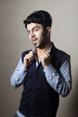 Obraz premium Iraqi brunette boy in strange pose inside studio