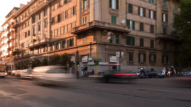 Time-lapse of busy traffic on a street corner in Rome, Italy. Cropped.