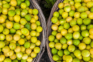 Limes an lemons in two baskets