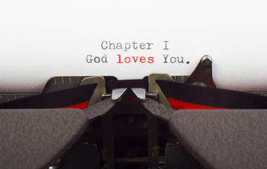 "God's love" written on old typewriter