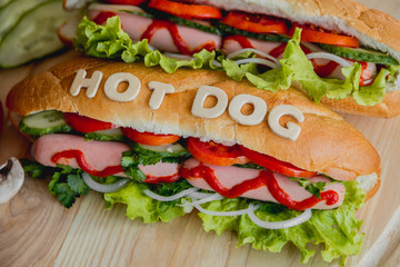 Large hot dog with vegetables