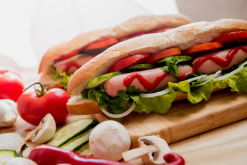 Large hot dog with vegetables