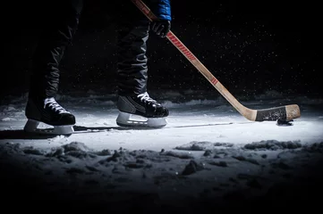 Abwaschbare Fototapete Hockey player. Legs only view © Vasilev Evgenii