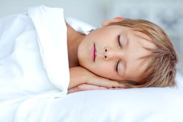 Fototapeta premium happy little boy in morning bed 
