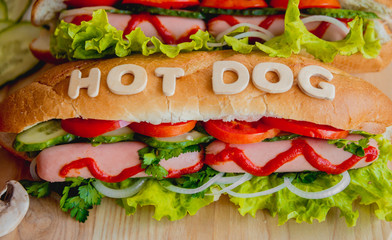 Large hot dog with vegetables