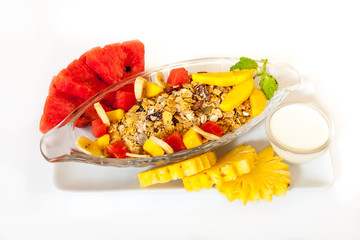 Muesli with fresh fruits and yogurt isolated on white