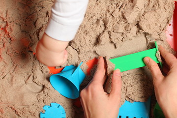 child playing with kinetic sand