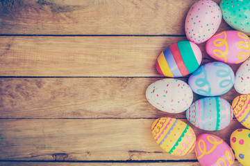 Easter eggs on wooden background with vintage tone. - Powered by Adobe