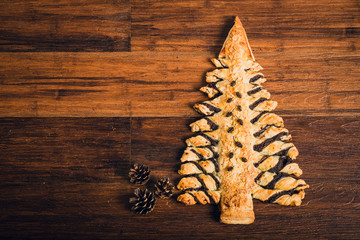 Christmas tree cake on wooden table