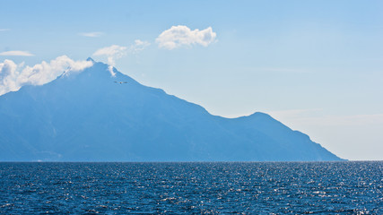 Aegean sea and silhouette of the holy mountains Athos, Greece