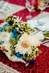 Wedding rings on a background of a bouquet