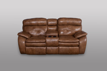 Brown leather sofa on a gray background in the studio