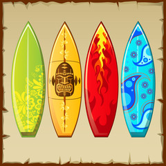 Four surfboards with different pattern