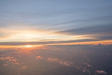 Morning Sun & Cloudy sky from airplane Through window onto jet engine -  flying view (window...