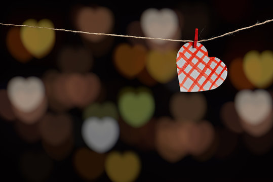 Paper heart on dark background