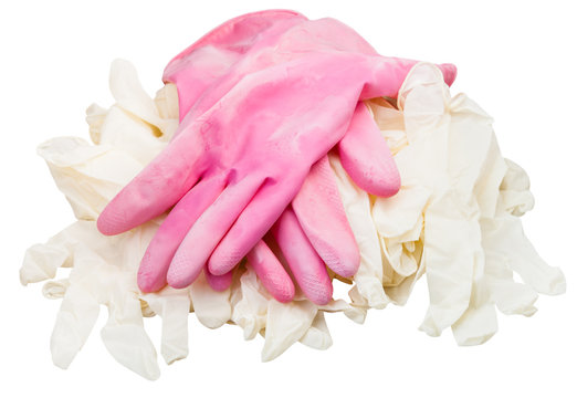 pair ofused pink protective gloves on new gloves