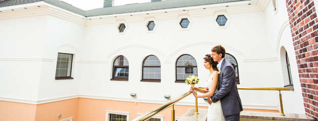 wedding  beautiful young  couple stand on the balcony