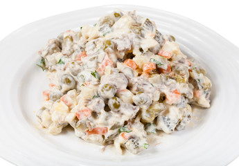 olivier russian salad with mayonnaise on plate