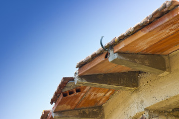 Detail of the eaves of an old roof taken from below