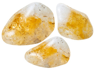 three yellow citrine quartz gemstones isolated