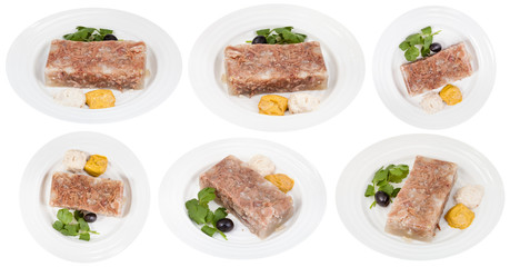 set of white plates with beef aspic isolated